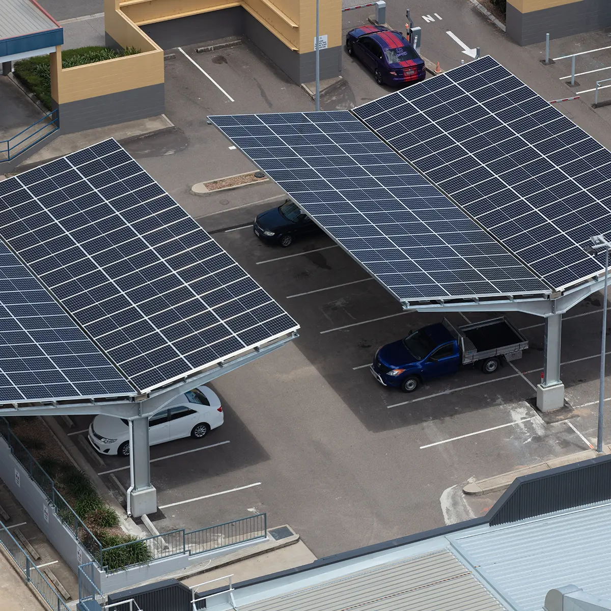 EcoPort cantilever solar carport structure providing shaded parking and renewable energy generation, designed by CSE Linked for cyclone resilient installations.